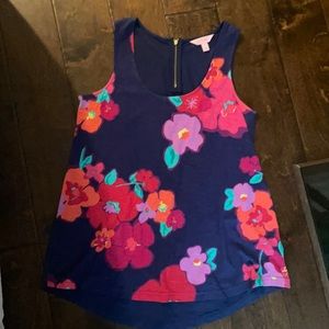 Floral lily tank with a gold zipper in the back